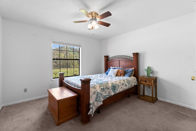 bedroom with ceiling fan and light carpet