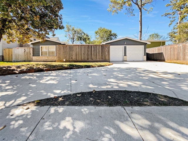 view of home's exterior with an outbuilding and a garage