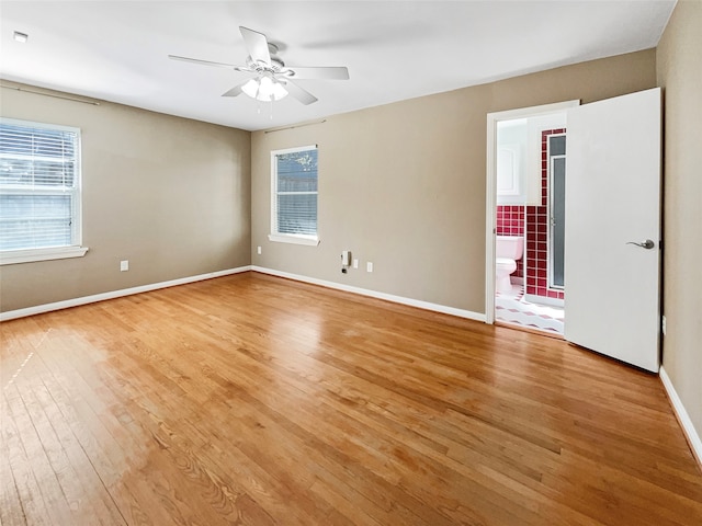 unfurnished room featuring light hardwood / wood-style floors and ceiling fan