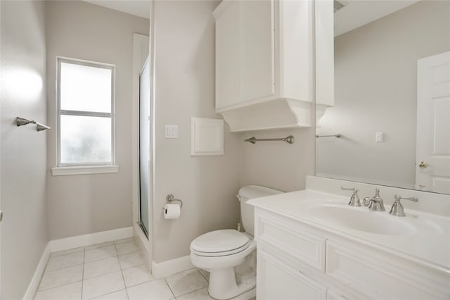 bathroom featuring vanity, tile patterned flooring, toilet, and an enclosed shower