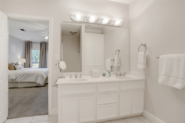 bathroom featuring vanity, ceiling fan, and tile patterned flooring