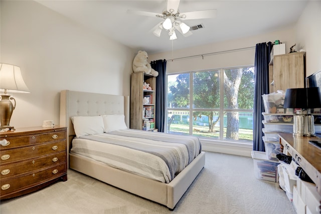 bedroom featuring ceiling fan and light colored carpet