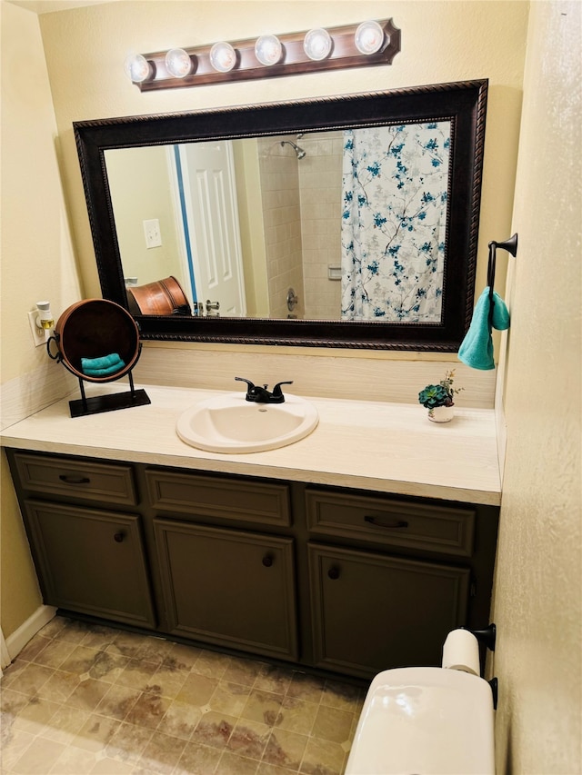 bathroom with vanity and curtained shower