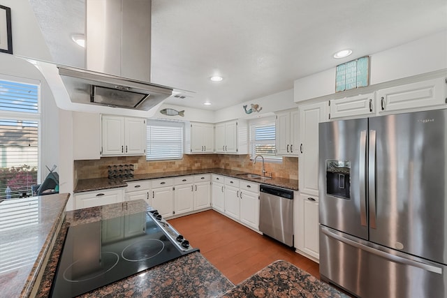 kitchen with appliances with stainless steel finishes, white cabinets, and sink