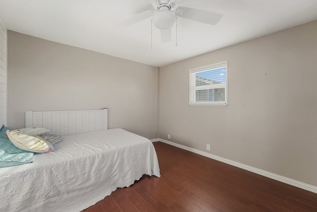 bedroom with dark wood-type flooring and ceiling fan