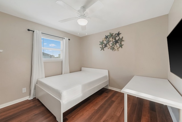 bedroom with dark wood-type flooring and ceiling fan