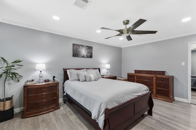 bedroom featuring light hardwood / wood-style flooring, ornamental molding, and ceiling fan