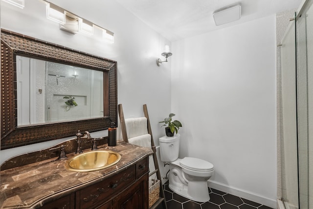 bathroom with vanity, toilet, a shower with shower door, and tile patterned flooring