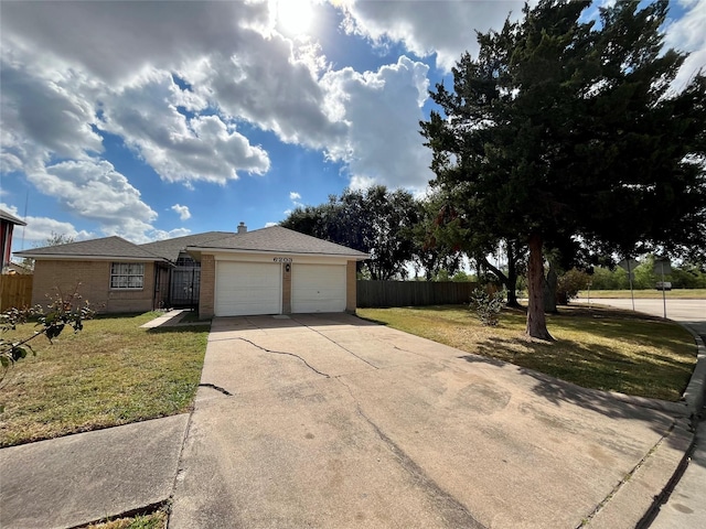 view of front of house featuring a front yard and a garage