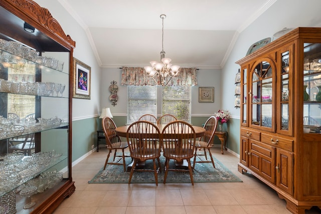 dining area featuring lofted ceiling, ornamental molding, and plenty of natural light