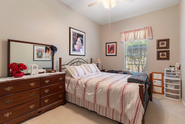 bedroom featuring light colored carpet and ceiling fan