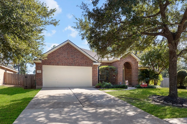 view of front of home featuring a front lawn and a garage