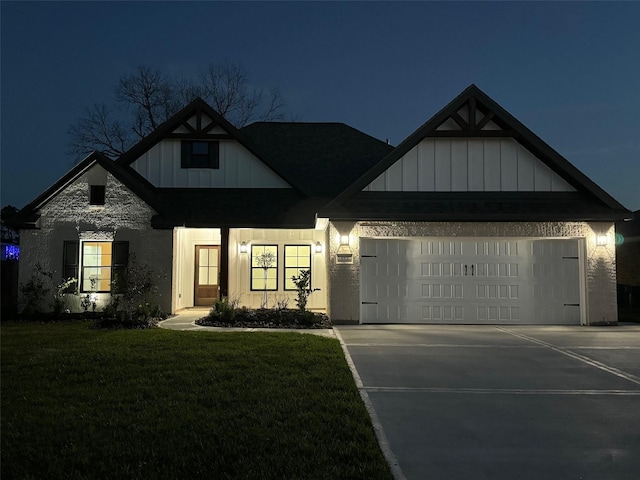 view of front of property featuring board and batten siding, concrete driveway, a lawn, and an attached garage