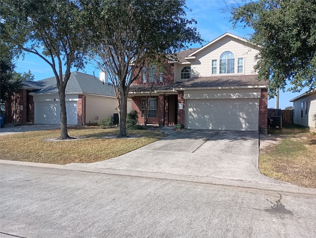 view of front property featuring a front yard and a garage