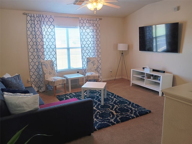 living room with carpet floors, vaulted ceiling, and ceiling fan