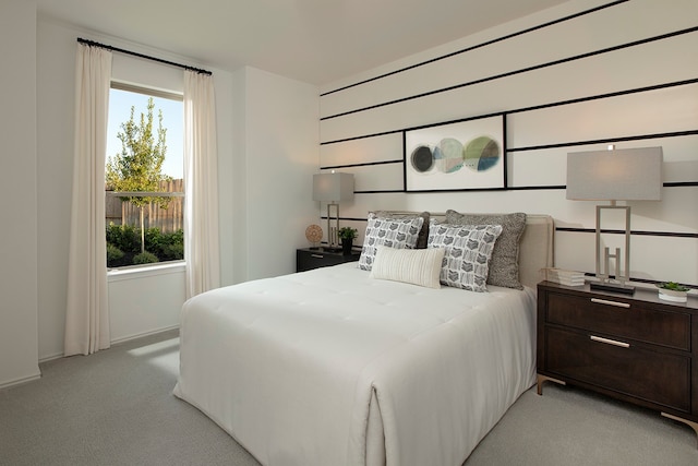 bedroom featuring light colored carpet