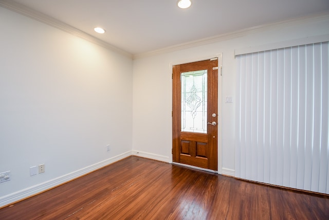 entryway with dark wood-type flooring and crown molding