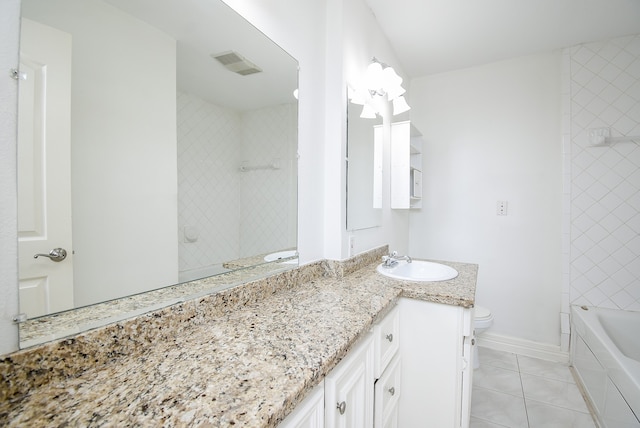 full bathroom with vanity, toilet, tile patterned flooring, and tiled shower / bath