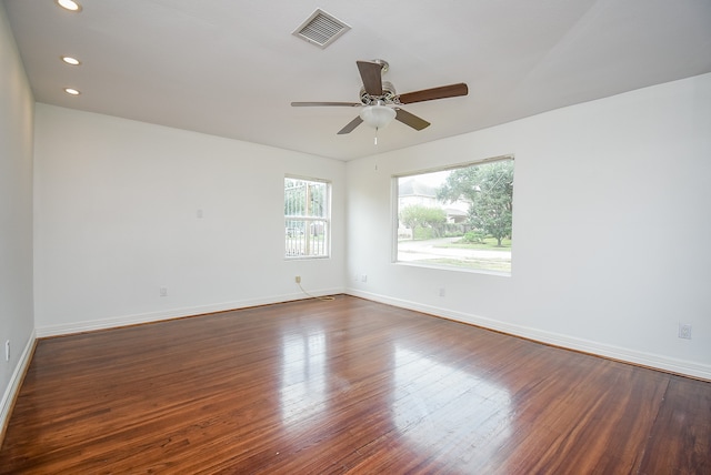 unfurnished room featuring dark hardwood / wood-style floors and ceiling fan