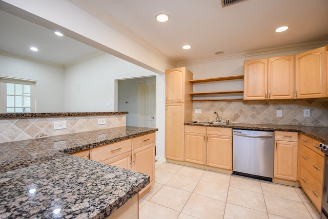 kitchen with light brown cabinetry, sink, and dishwasher