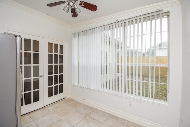 unfurnished sunroom featuring french doors, a healthy amount of sunlight, and ceiling fan