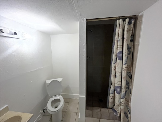 bathroom with toilet, tile patterned floors, and a shower with curtain