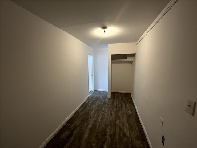 hallway featuring dark hardwood / wood-style flooring