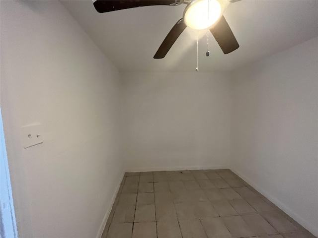 empty room with lofted ceiling and ceiling fan