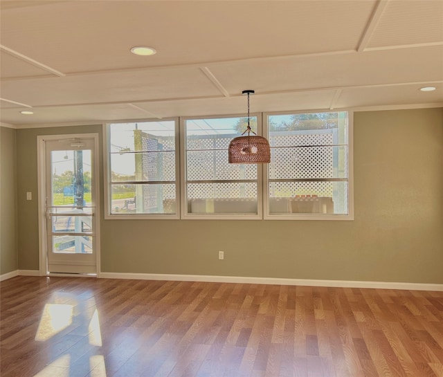 unfurnished dining area featuring hardwood / wood-style flooring