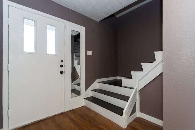 foyer with dark hardwood / wood-style flooring