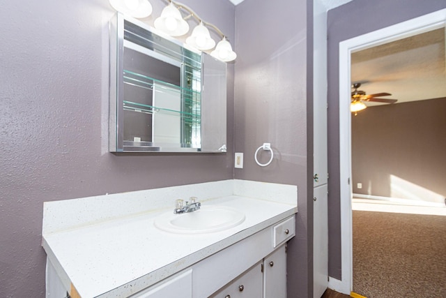 bathroom with ceiling fan and vanity