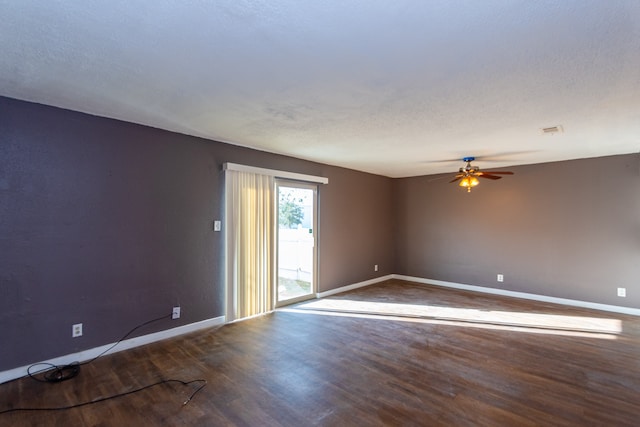 spare room featuring ceiling fan and wood-type flooring