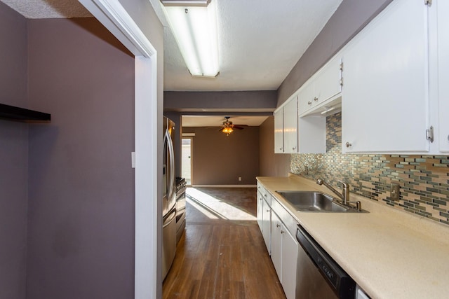 kitchen featuring dishwasher, sink, decorative backsplash, dark hardwood / wood-style flooring, and white cabinetry