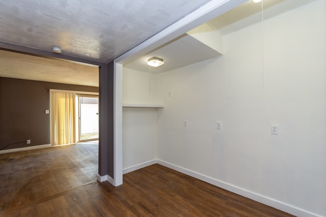 empty room featuring dark hardwood / wood-style floors