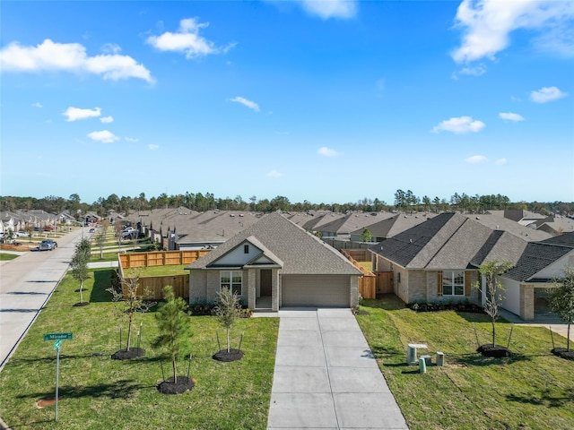 ranch-style house with a front yard and a garage