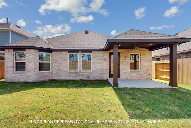 back of property with ceiling fan, a yard, and a patio