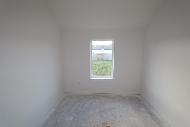 unfurnished room with concrete floors