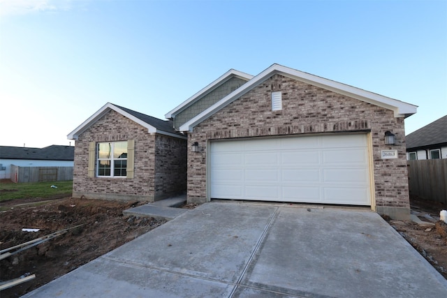 ranch-style house featuring a garage