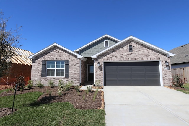 ranch-style home featuring driveway, brick siding, an attached garage, and fence