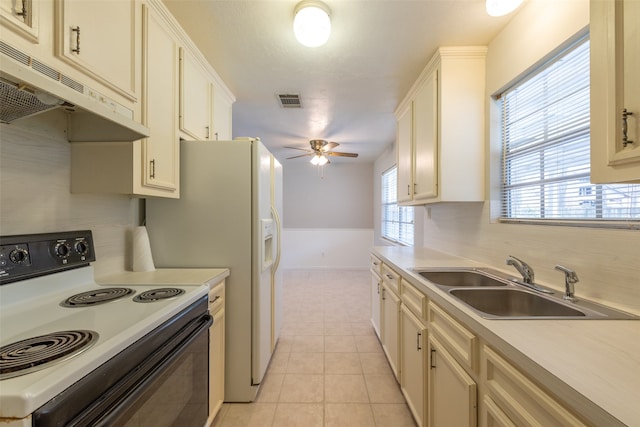 kitchen featuring tasteful backsplash, light tile patterned flooring, sink, ceiling fan, and white range with electric stovetop