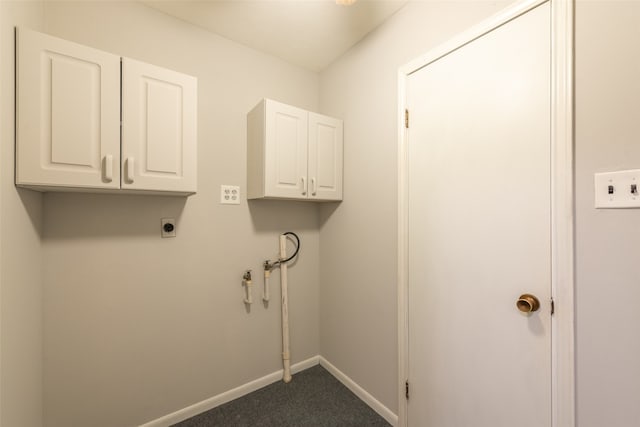 laundry room with hookup for an electric dryer, carpet floors, and cabinets