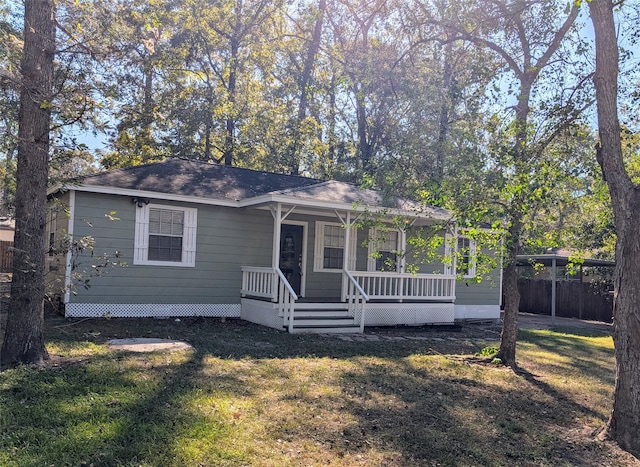 view of front of house with a porch and a front lawn