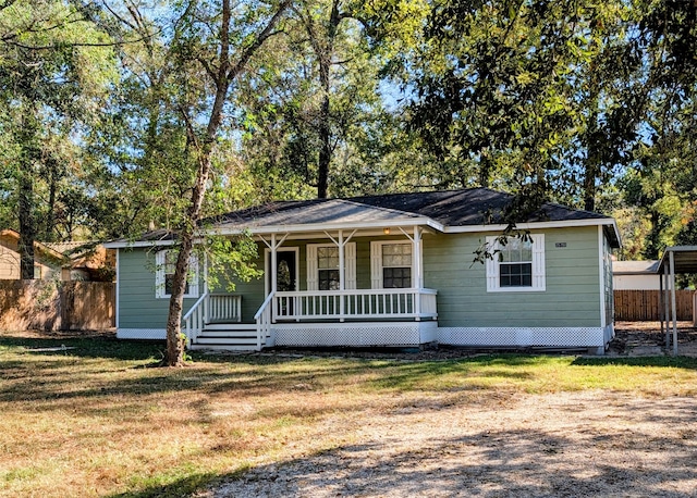 view of front of property with a front yard and a porch