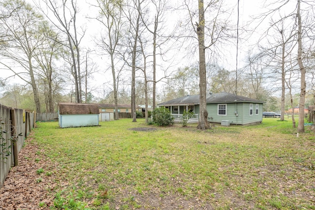 view of yard with a storage shed