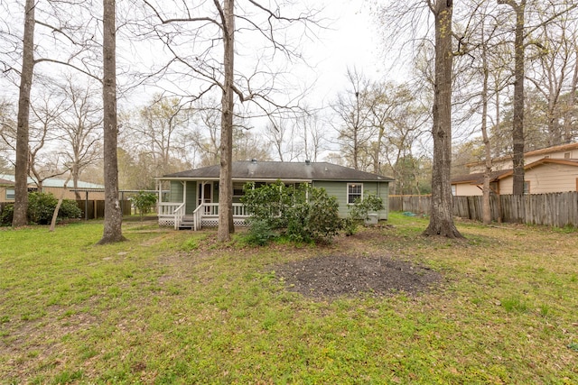 back of house with a yard