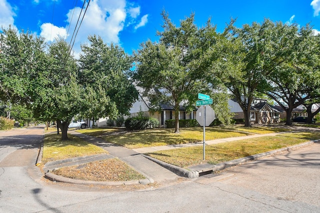 8218 Hazen St, Houston, TX 77036 - obstructed view of property with a front lawn