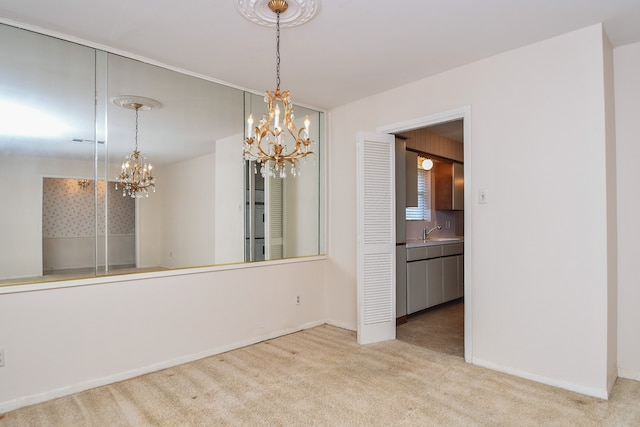 unfurnished dining area featuring sink, light colored carpet, and an inviting chandelier