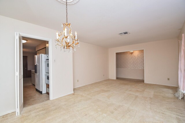 8218 Hazen St, Houston, TX 77036 - unfurnished room with a chandelier, light colored carpet, and baseboards