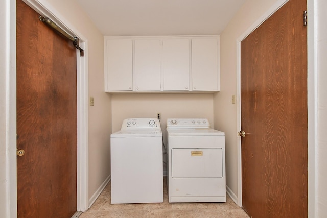 8218 Hazen St, Houston, TX 77036 - laundry room with cabinet space, washing machine and dryer, baseboards, and light tile patterned floors
