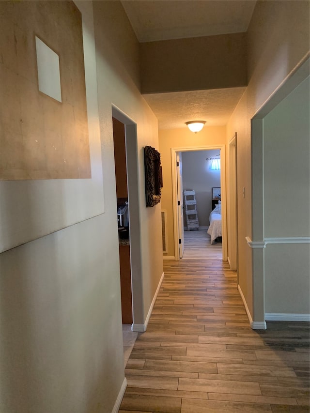 hallway featuring wood-type flooring